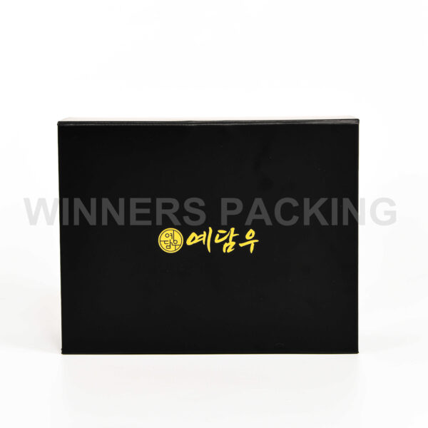 Front view of matte black collapsible magnetic gift box with gold foil logo